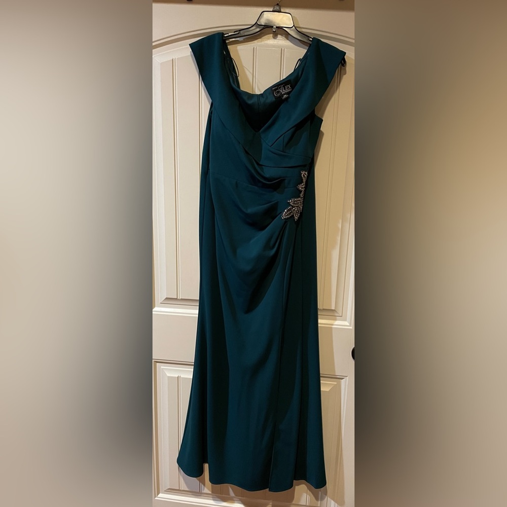 Emerald green formal full-length gown with split. Women’s size 18. Worn once.